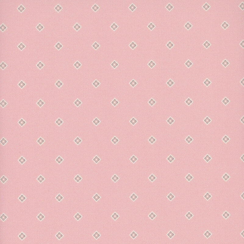 Pastel pink fabric tossed with floral diamonds.