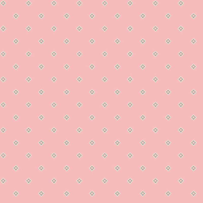 Pastel pink fabric tossed with floral diamonds.