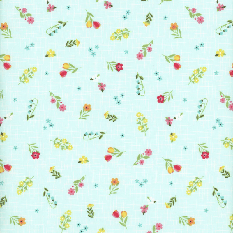 Soft aqua fabric with a pattern of colorful summer florals accented by a subtle textured background.