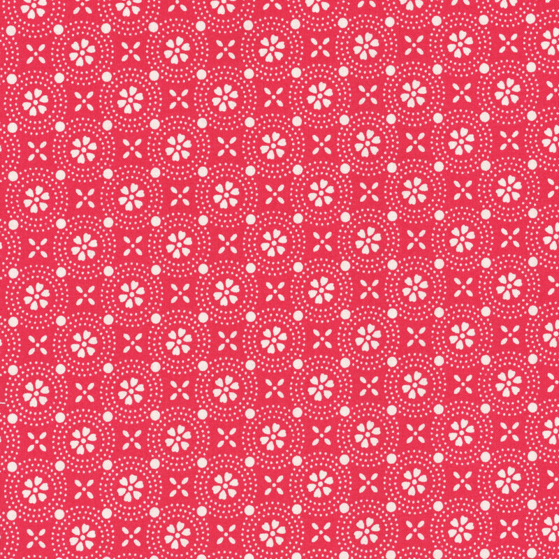 Bright red fabric with a geometric design of stylized white flowers.