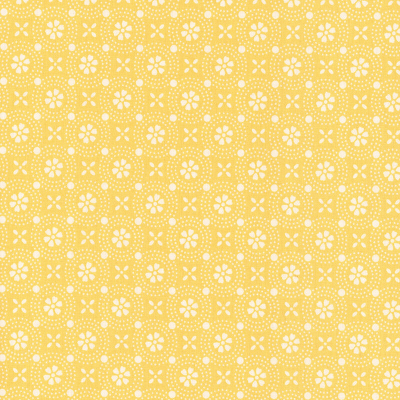 Bright yellow fabric with a geometric design of stylized white flowers.