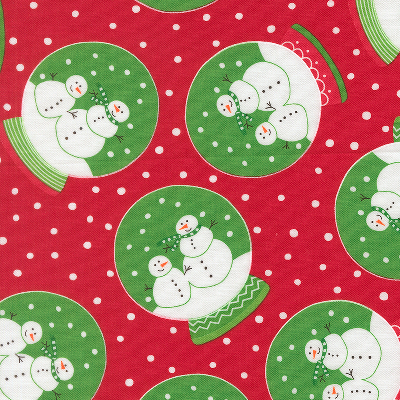 Bright red fabric with white dots featuring snow globes with green dye, white snow, and two festive snowmen with decorated bases.