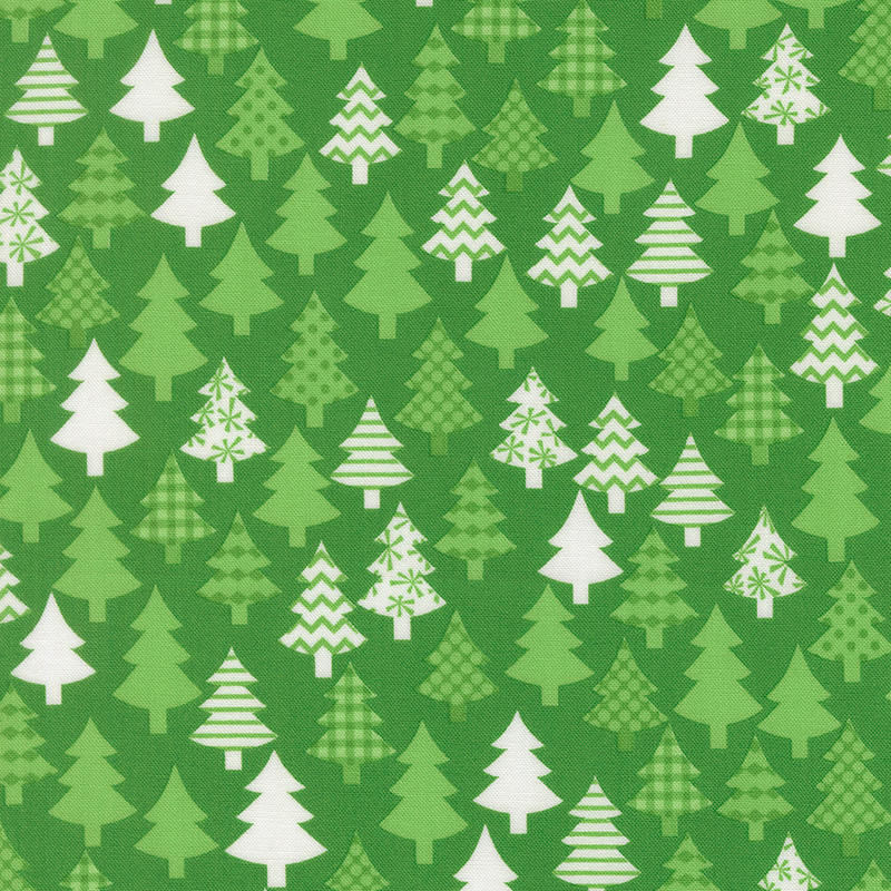 Kelly green fabric featuring tonal green and white decorated trees.