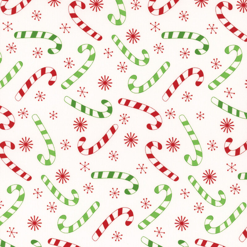 Winter white fabric tossed with red and green striped candy canes and red snowflakes.