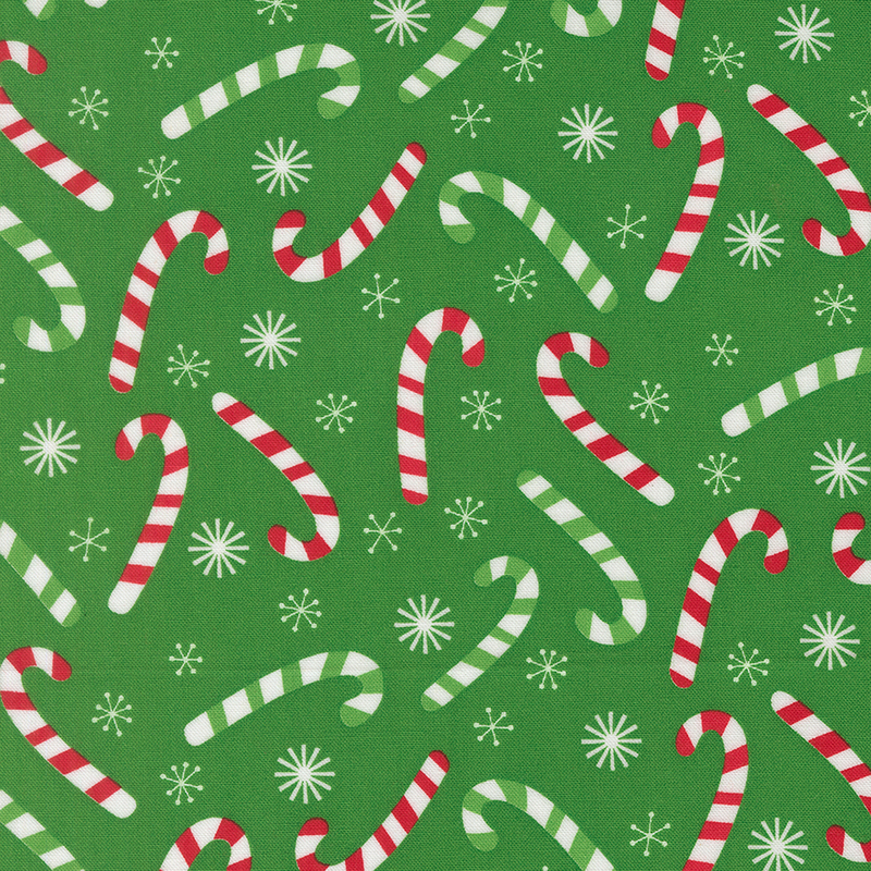 Kelly green fabric tossed with red and green striped candy canes and white snowflakes.
