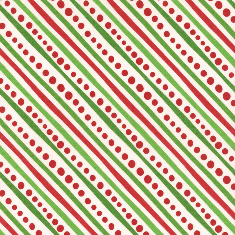 Winter white fabric featuring diagonal stripes of red and green with red dots.