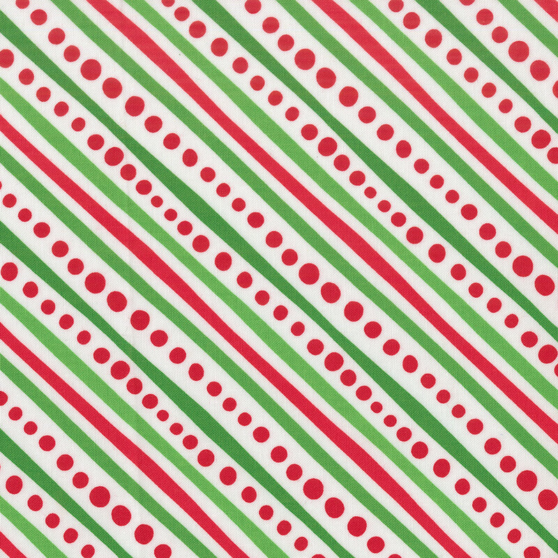Winter white fabric featuring diagonal stripes of red and green with red dots.