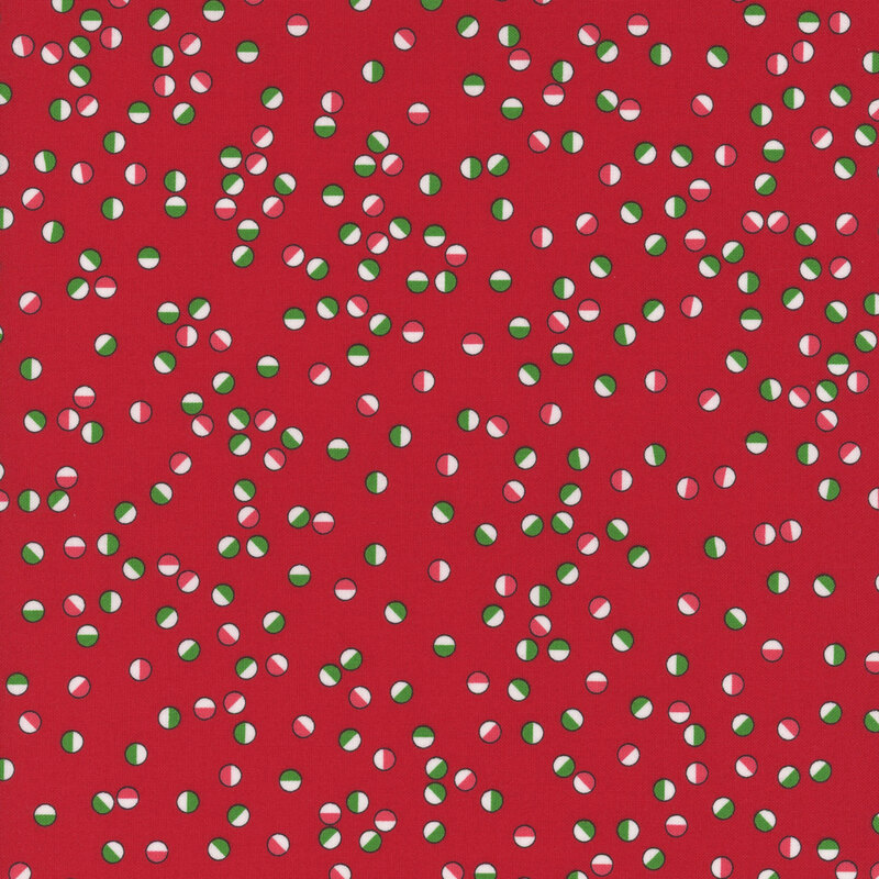 Festive circles in reds, greens, and white tossed on a cherry red background.