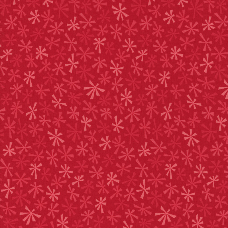 Stylized tonal snowflakes on a cherry red background.
