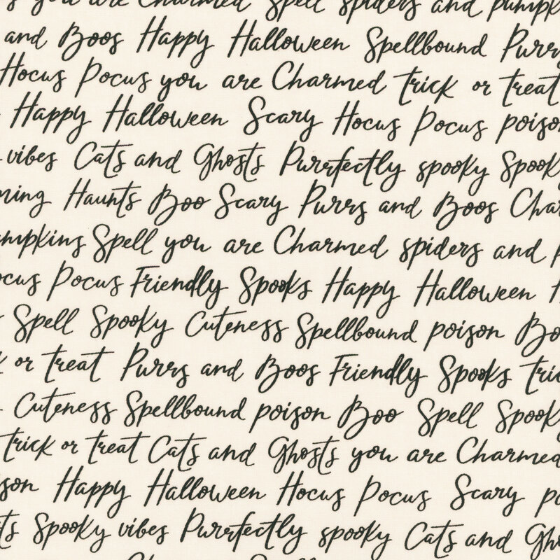 Cream fabric with rows of Halloween-themed words and phrases in cursive script.