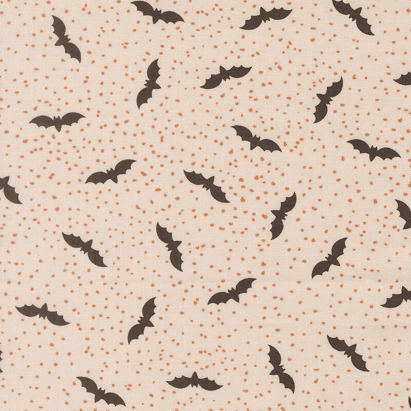 Cream fabric with tiny scattered orange dots and flying bats.