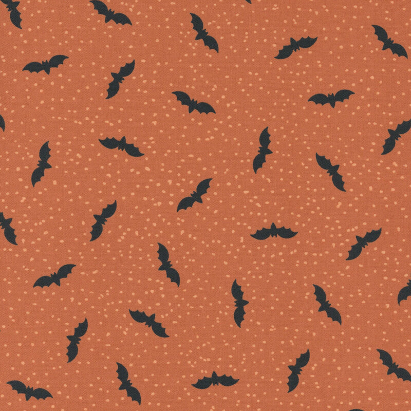 Orange fabric with tiny scattered light dots and flying bats.