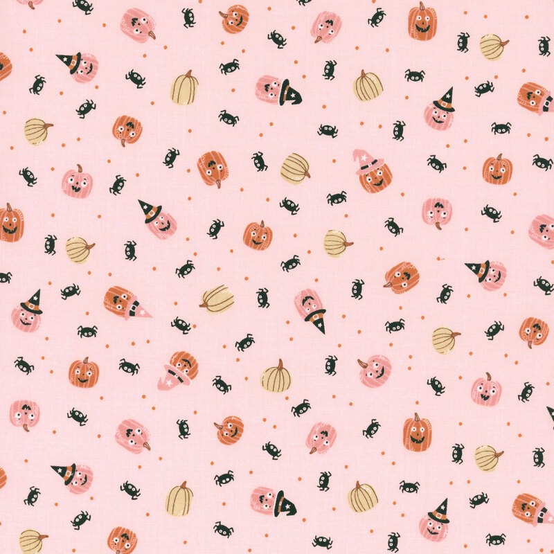 Light pink fabric with tossed pinprick dots, pumpkins, and spiders.