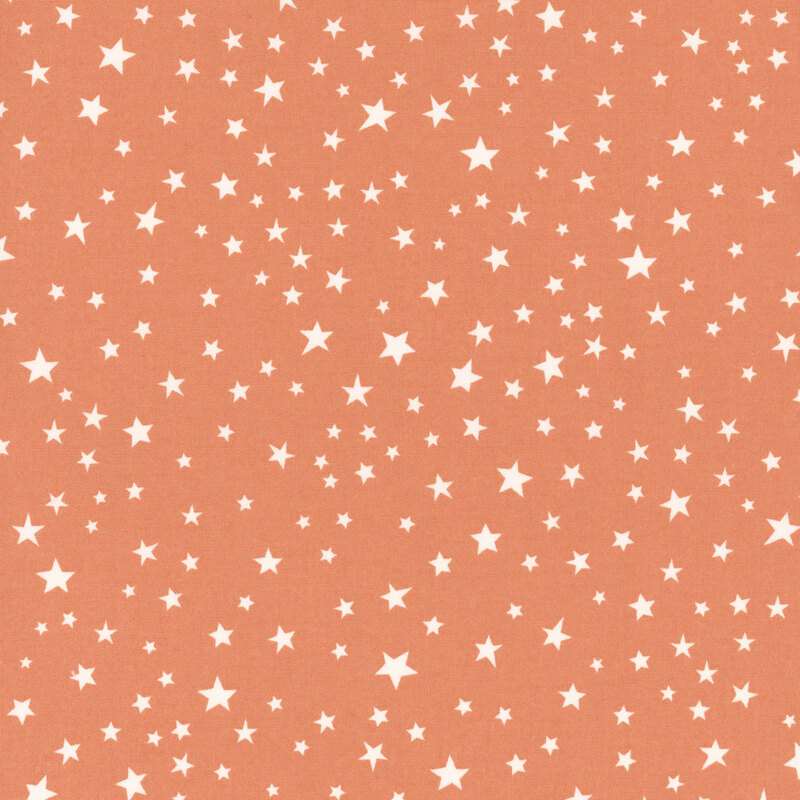 Orange fabric with scattered white stars.