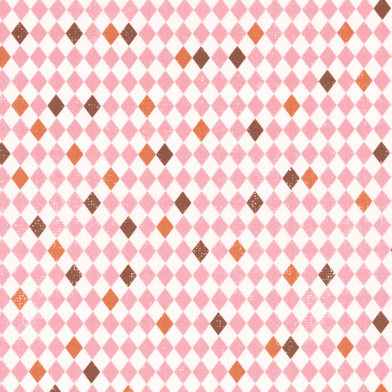 White and pink diamond-checkered fabric with scattered orange and brown tiles.
