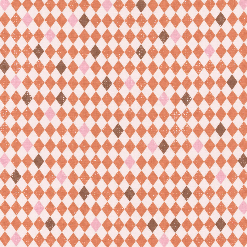 Off-white and orange diamond-checkered fabric with scattered brown and pink tiles.