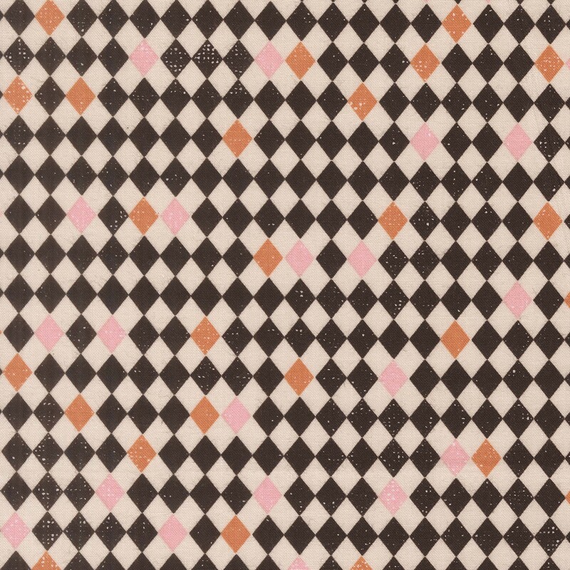 Black and off-white diamond-checkered fabric with scattered orange and pink tiles.