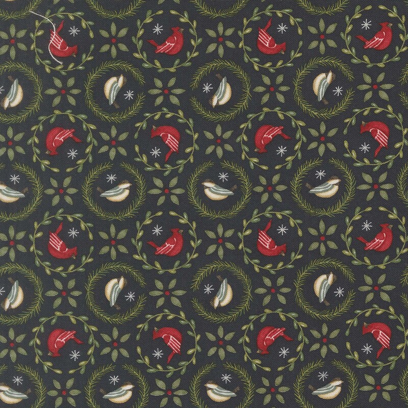 Dark navy blue fabric with cardinals and finches surrounded by leaf-garlands and star shaped leaves in between