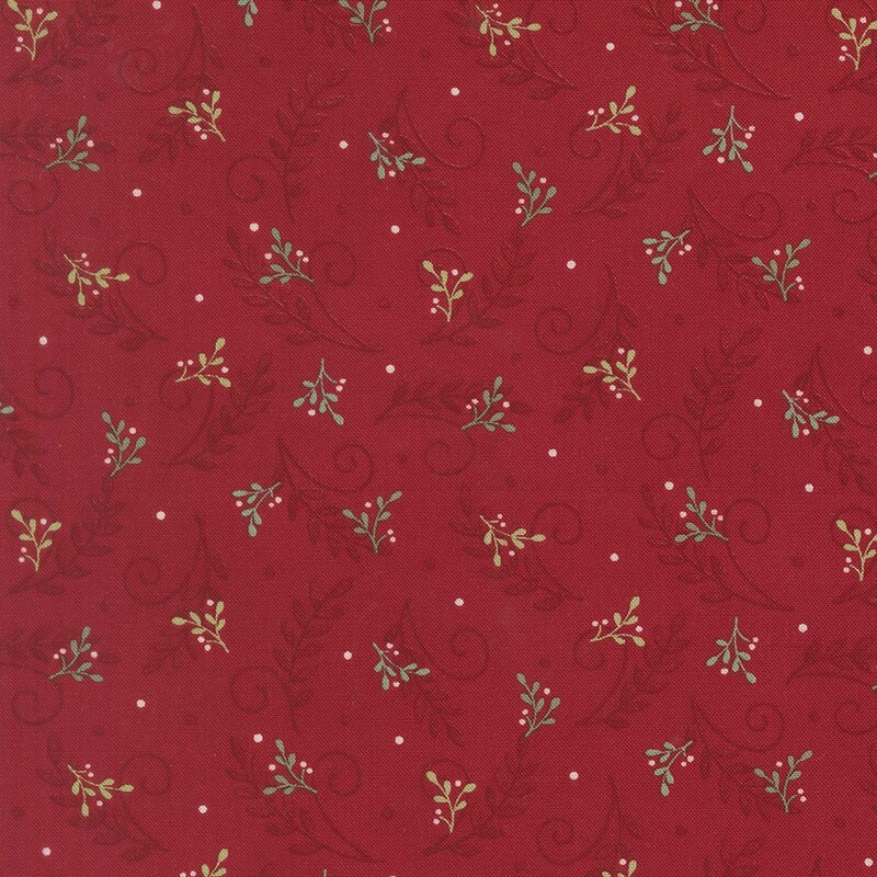 Cardinal red fabric with a tossed pattern of garnet leaves and swirls with green holly sprigs and white berries