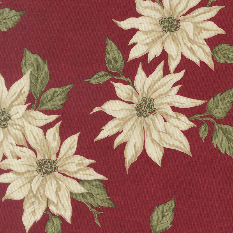 Red fabric with a pattern of large, stylized cream poinsettias.