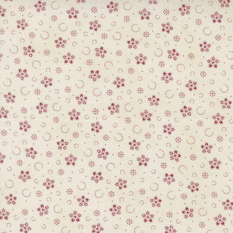 Mottled white fabric with a pattern of stylized red snowflakes and tiny pindots.