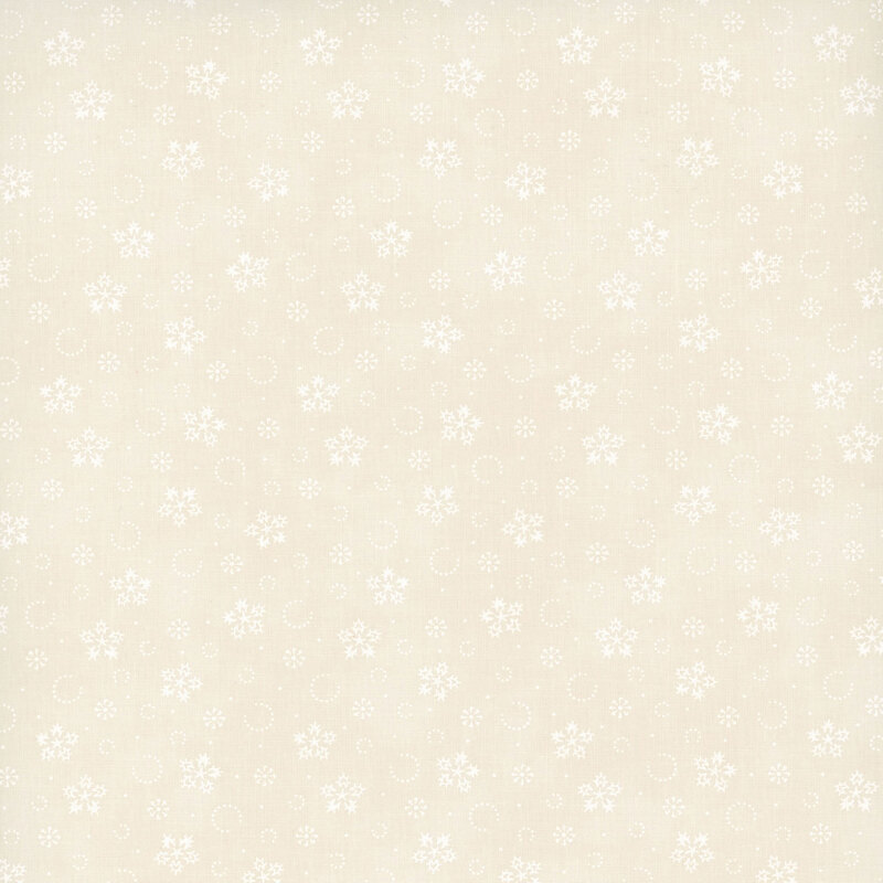 Mottled cream fabric with a tonal pattern of stylized snowflakes and tiny pindots.