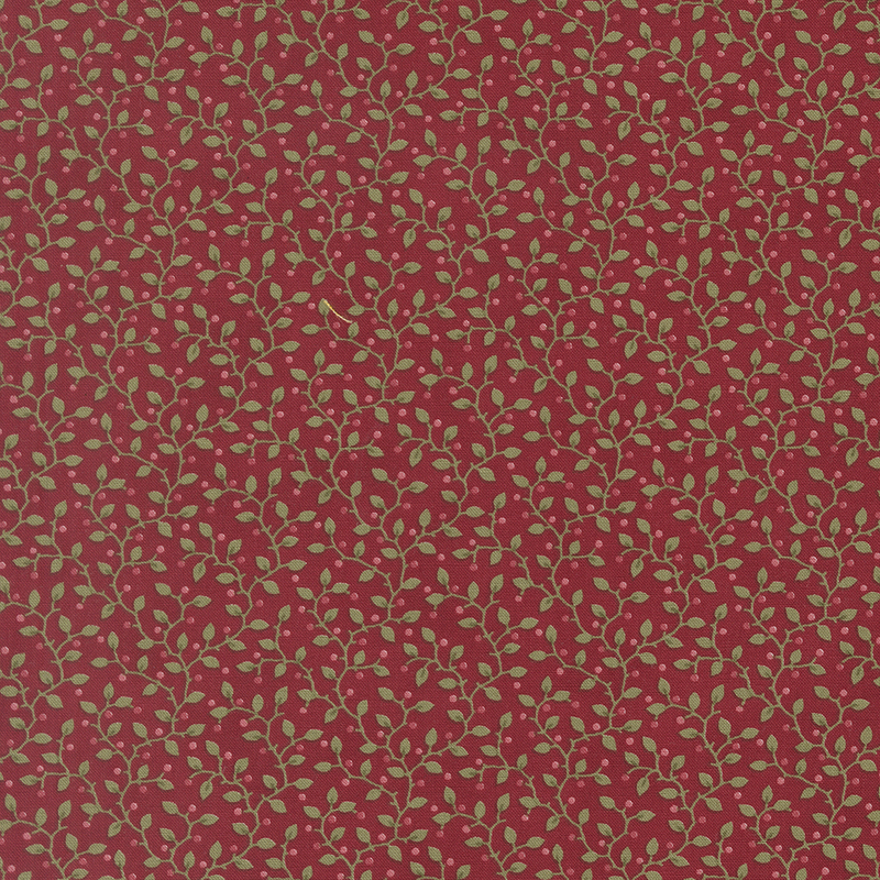 Dark red fabric with a pattern of leaves accented with subtle sprigs.