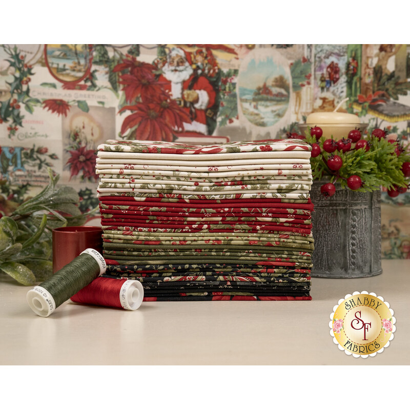 A stack of the fabrics included in the Candlenight Christmas Fat Eighth set, with a panel in the background and mistletoe and candles and thread.