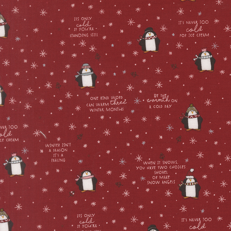 Red fabric with a whimsical pattern of cartoon penguins, snowflakes, stars, holly, and winter-themed phrases.