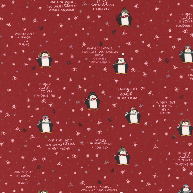 Red fabric with a whimsical pattern of cartoon penguins, snowflakes, stars, holly, and winter-themed phrases.