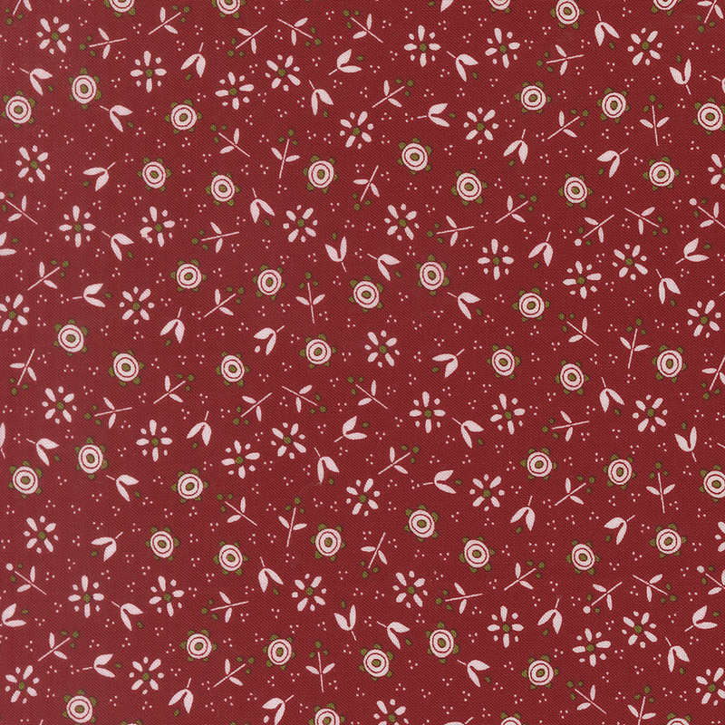 Red fabric adorned with a pattern of small calico florals and pin dots.