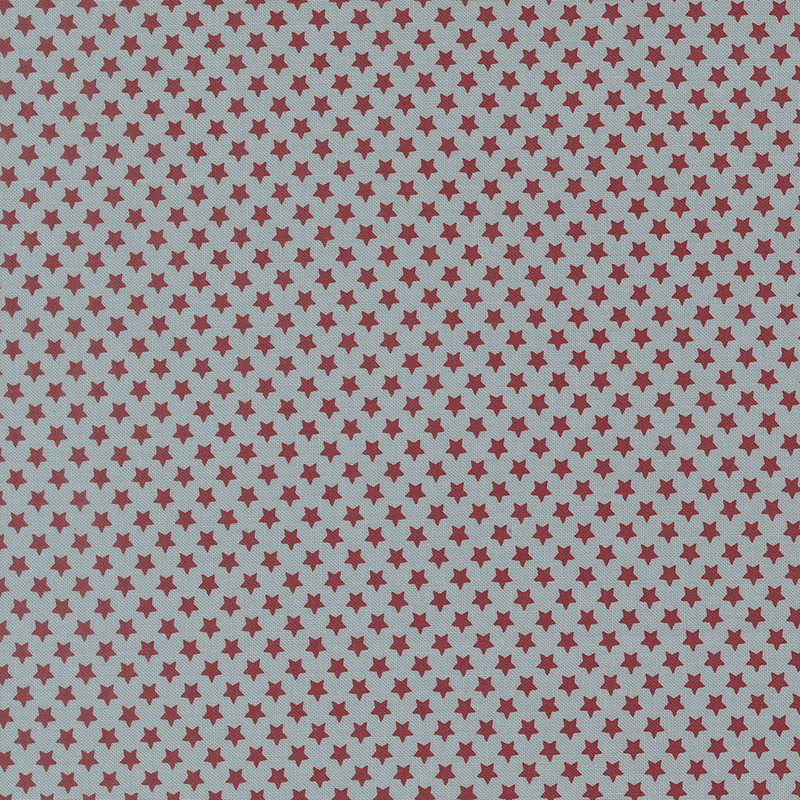 Muted aqua fabric with small, densely arranged red stars.