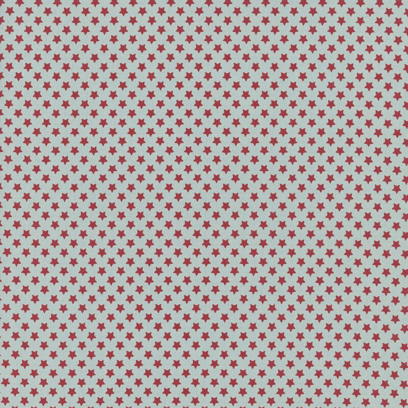 Muted aqua fabric with small, densely arranged red stars.