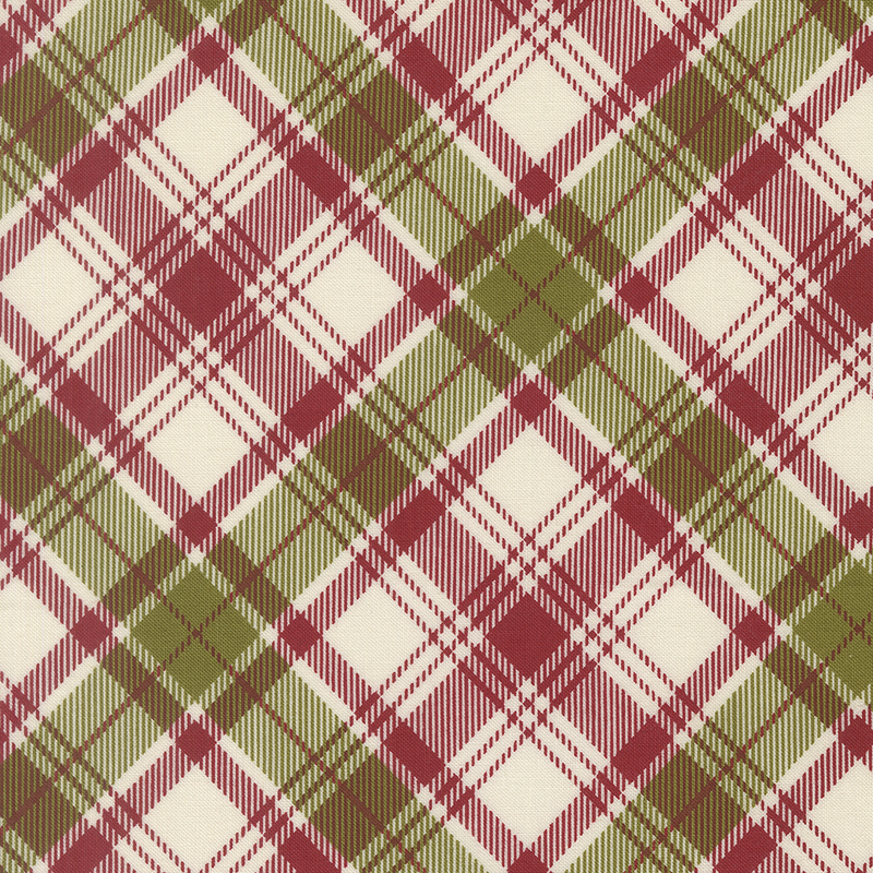 Cream fabric decorated with a timeless diagonal red and green plaid pattern.