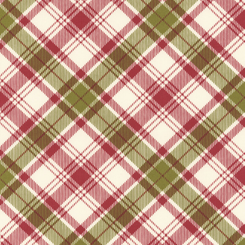 Cream fabric decorated with a timeless diagonal red and green plaid pattern.