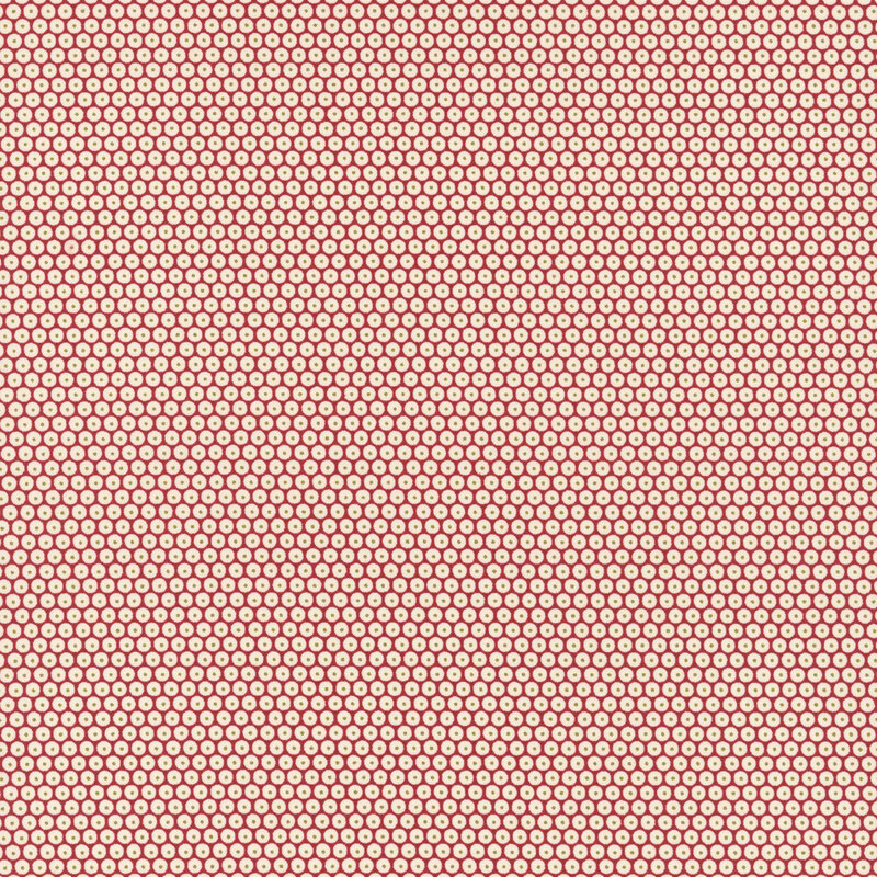 Red fabric is adorned with a dense pattern of white circles accented by green-centered dots.