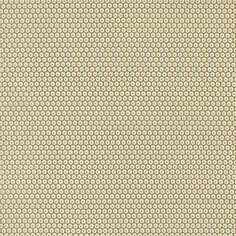Green fabric with a dense pattern of white circles accented by red-centered dots.