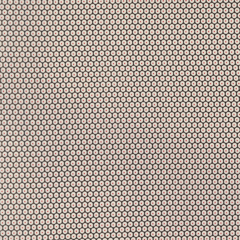 Black fabric with a dense pattern of white circles accented by red-centered dots.