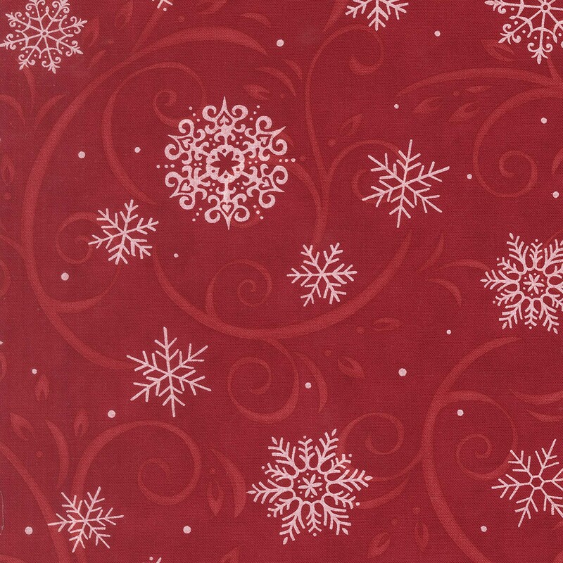 Cardinal red fabric with scarlet flourishes and white snowflakes