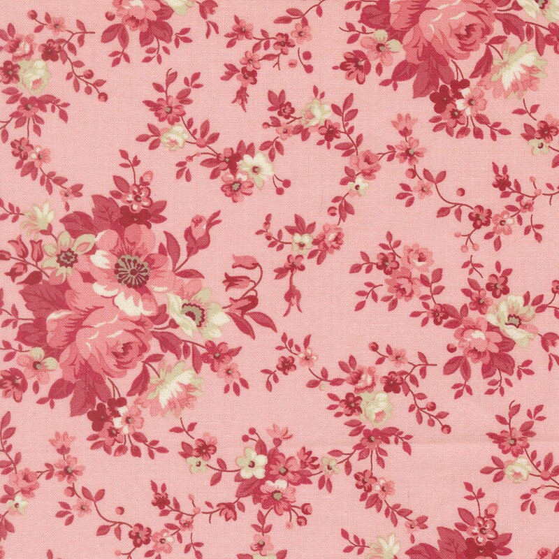 Blush pink fabric with a shabby pattern of ruby vines, pink roses, and beige flowers
