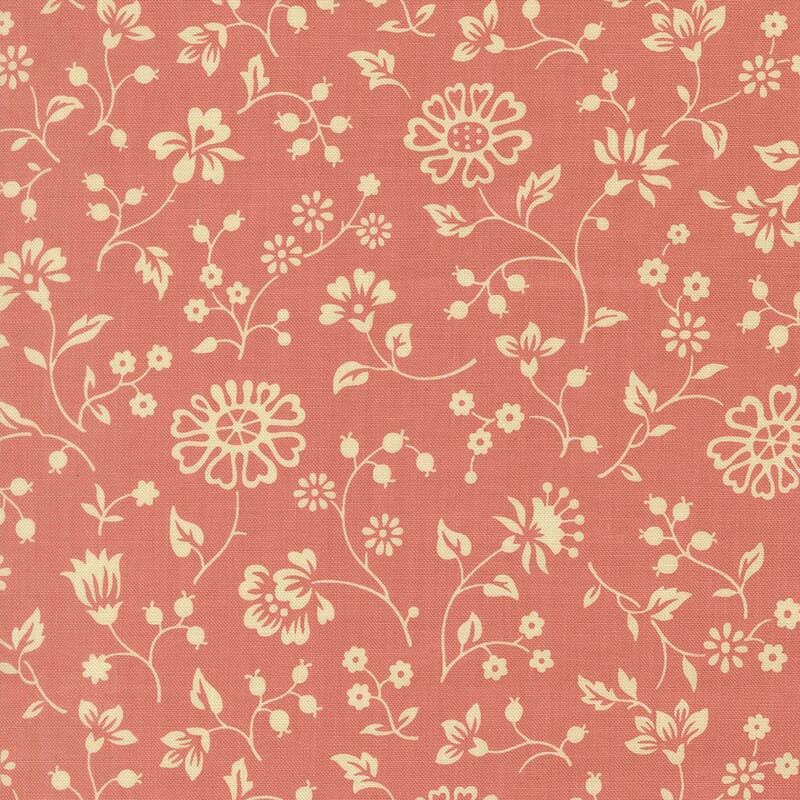 Coral fabric with a spaced pattern of light cream beige florals and vines