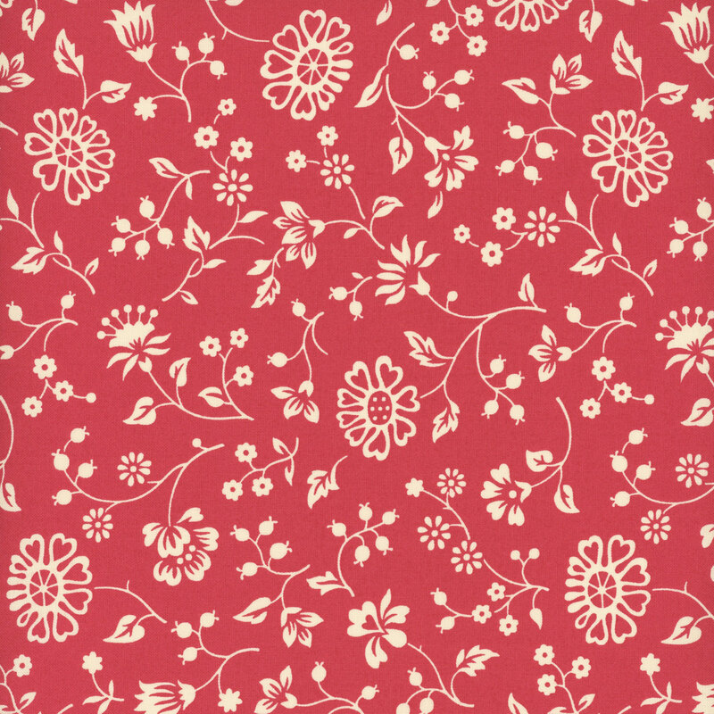 Watermelon red fabric with a spaced pattern of light cream beige florals and vines.
