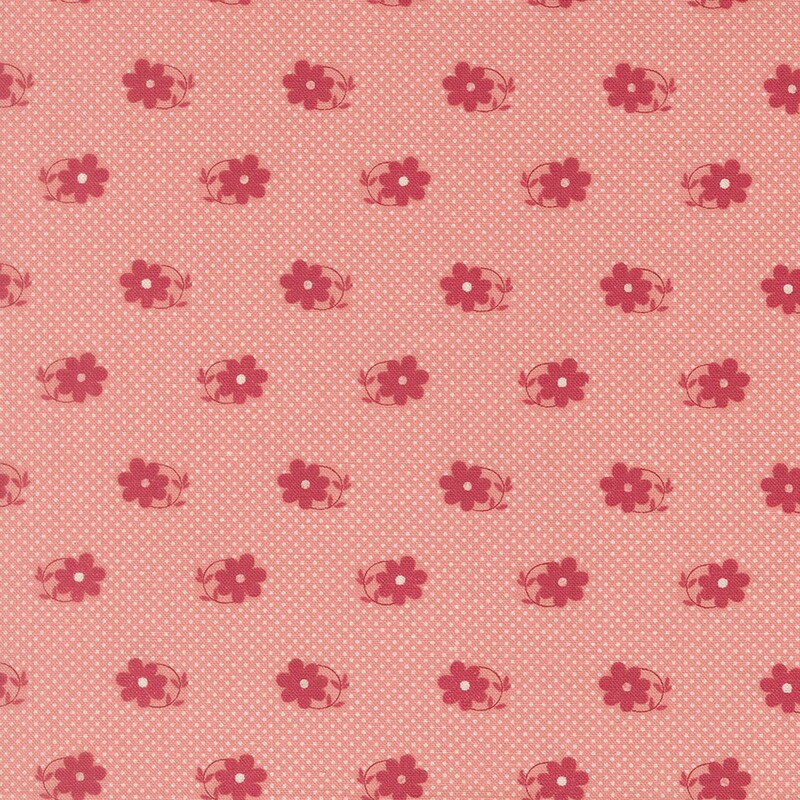 Pink fabric patterned with tiny white pin-dots and magenta daisies with circular stems