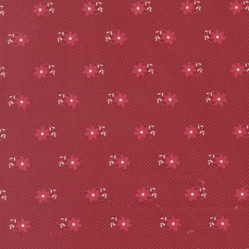 Cherry red fabric patterned with tiny pink pin-dots and magenta daisies with white circular stems