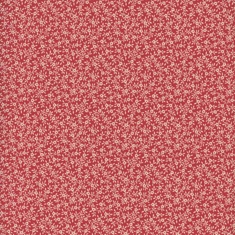 Watermelon red fabric with a dense pattern of beige vines and flowers.