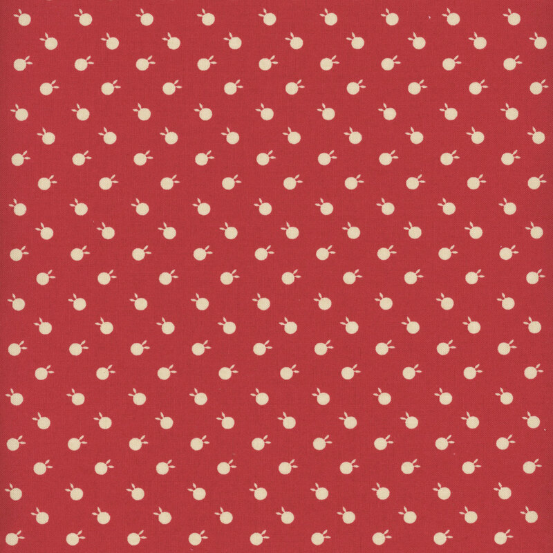 Cherry red fabric featuring beige polka dots with bunny ears.
