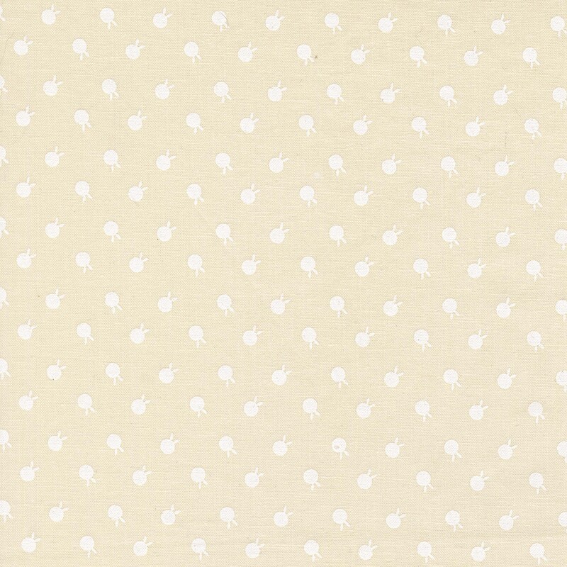 Cream beige fabric featuring ivory polka dots with bunny ears