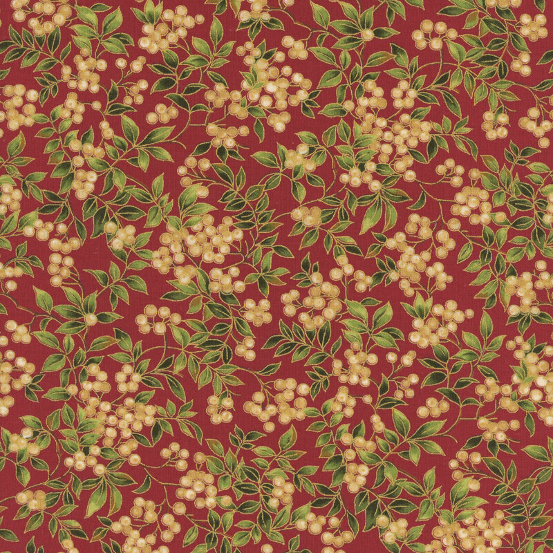 White holly berries on long branches with gold metallic accents on deep red fabric.