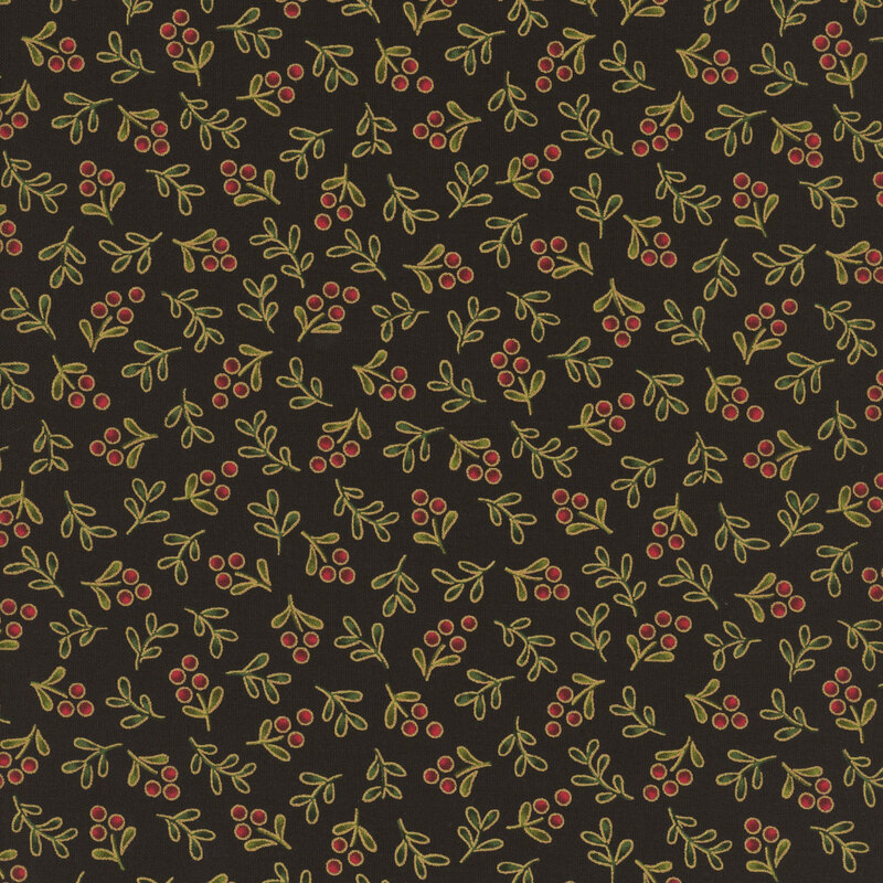 Delicate holly sprigs with gold metallic accents tossed on a black background.