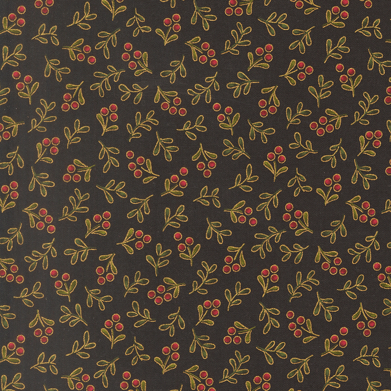 Delicate holly sprigs with gold metallic accents tossed on a black background.